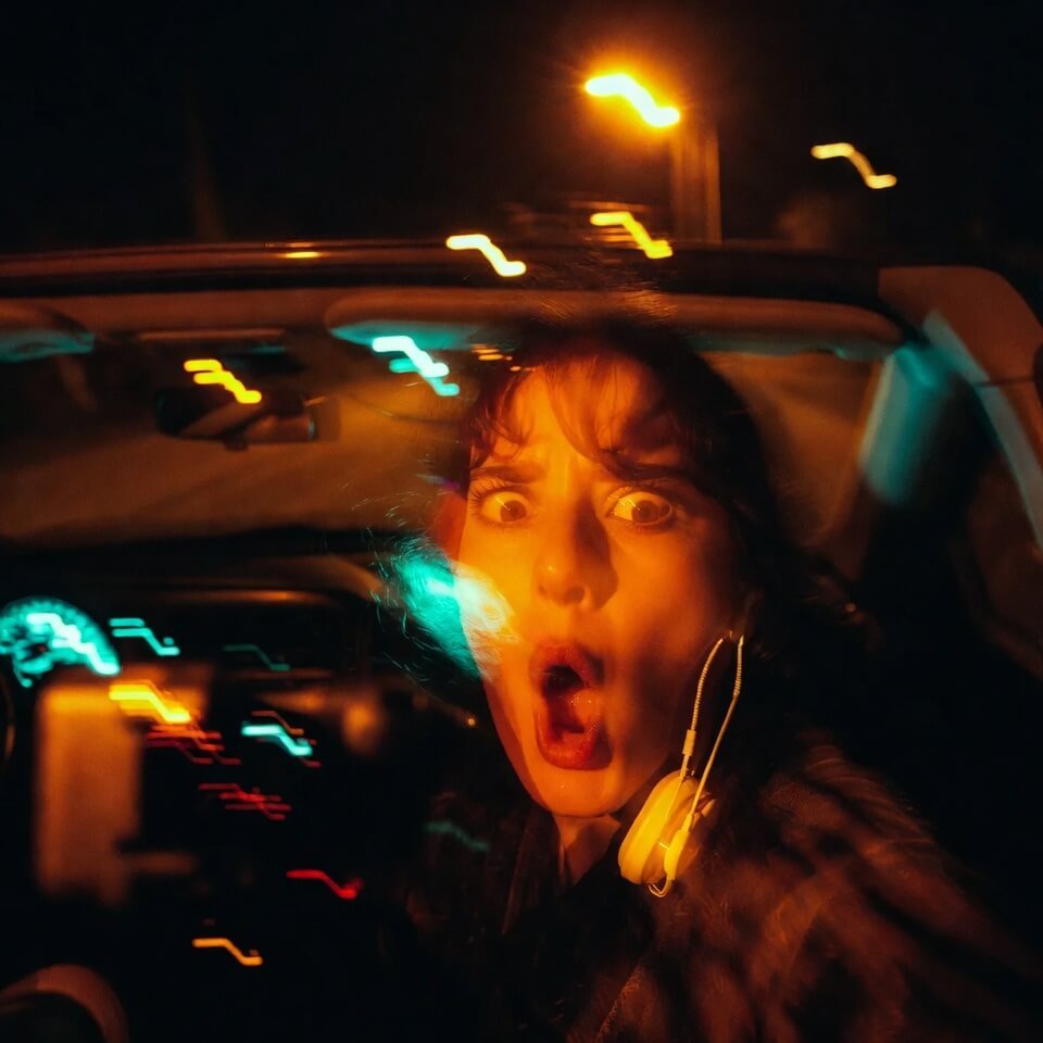 Blurry 2:17 a.m. car selfie: screaming with hazard lights flashing (9 words)